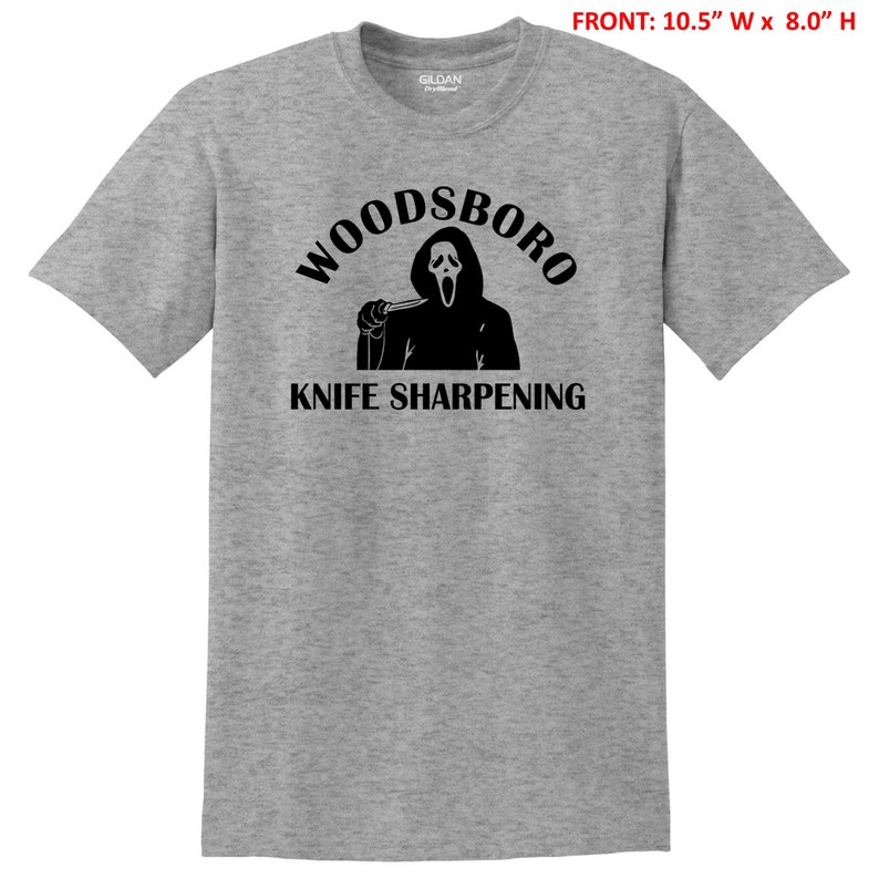 May include: A gray t-shirt with a black graphic of a ghost holding a knife and the text "Woodsboro Knife Sharpening".