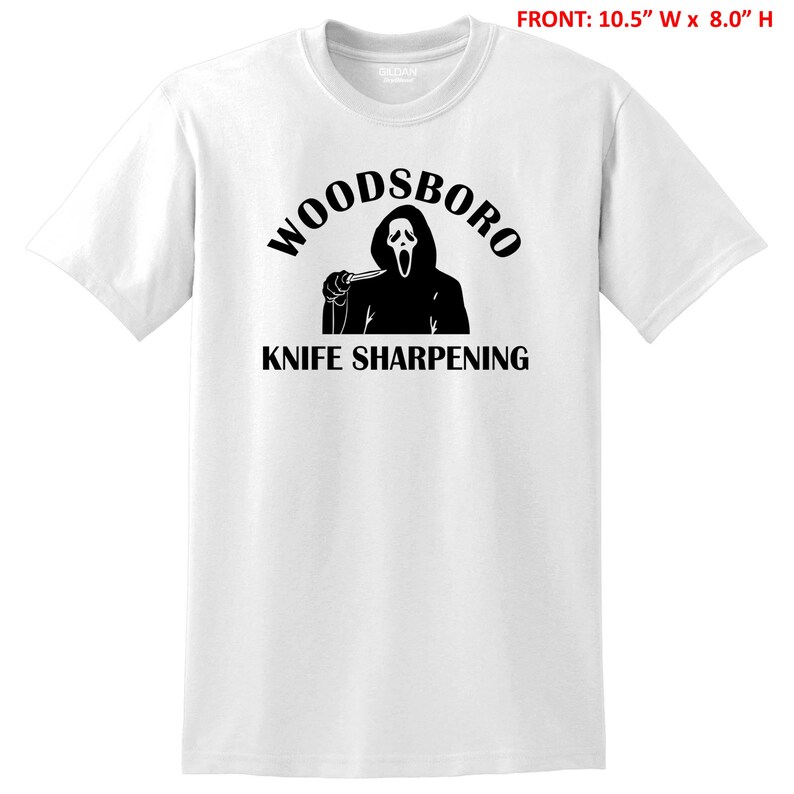 May include: White t-shirt with a black graphic of a ghost holding a knife and the text "Woodsboro Knife Sharpening"