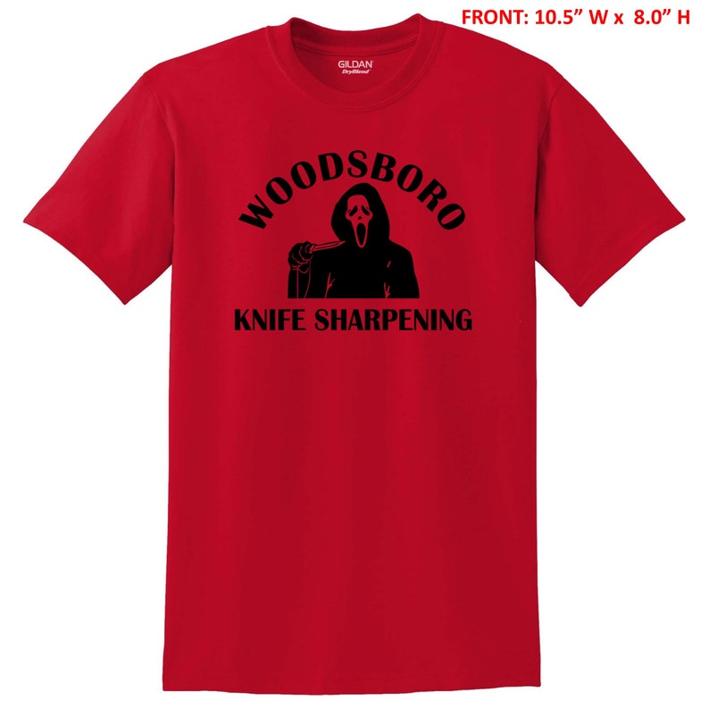 May include: Red t-shirt with a black graphic of a ghost holding a knife and the text "Woodsboro Knife Sharpening".