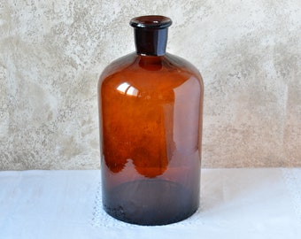 ヴィンテージの茶色のガラス製薬瓶：1930年代のラベル付き薬局ボトル