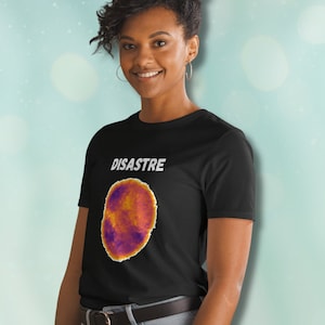 May include: A black t-shirt with a graphic of a colorful, abstract design and the word "DISASTRE" printed in white.
