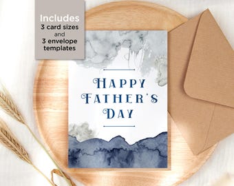 May include: A Father's Day card with watercolor mountain and cloud designs in shades of blue and gray. The card reads "Happy Father's Day" in elegant navy blue script. Includes 3 card sizes and 3 envelope templates.