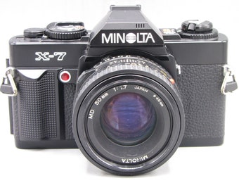 Vintage Minolta X7 35mm SLR film Camera w 1.7/50 Clad Seals Battery