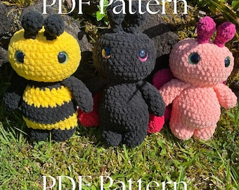 May include: Three crocheted plush toys: a yellow and black bee, a black bug with red wings, and a pink bug with pink antennae. The toys have large, round eyes and are displayed on a bed of green grass. The text "PDF Pattern" is written above and below the toys.