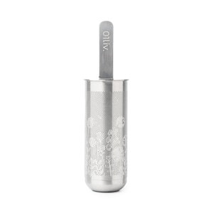 May include: A silver tea infuser with a floral design and a long handle. The handle has the word "OLIV" printed on it.