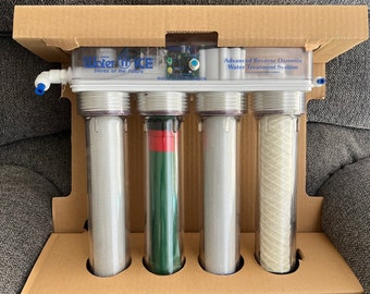 May include: An advanced reverse osmosis water treatment system, displayed in its original cardboard packaging. The system features four clear cylindrical filter housings, with the text "Water Wise Stores of the Future" and "Advanced Reverse Osmosis Water Treatment System".