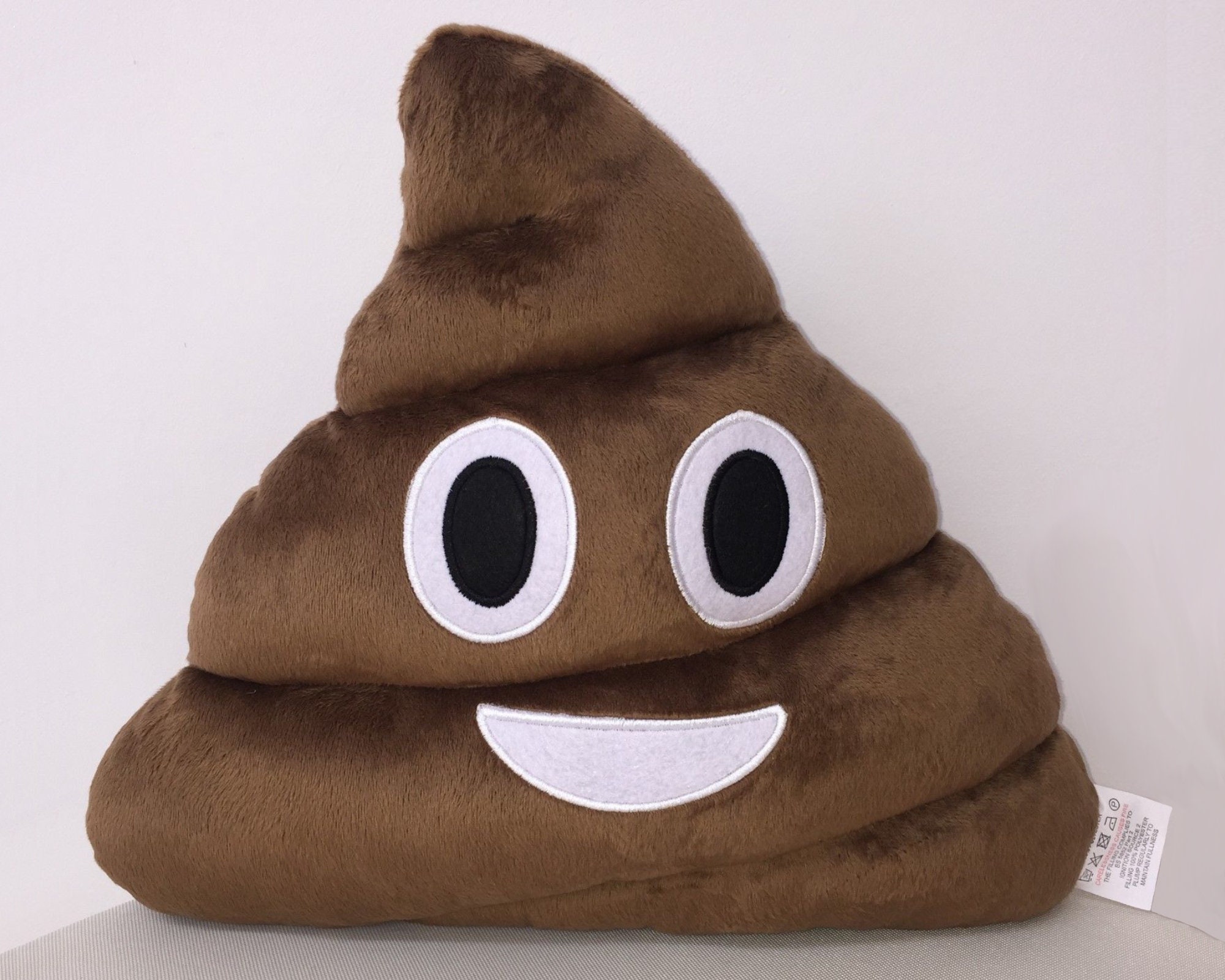 poop emoji pillow