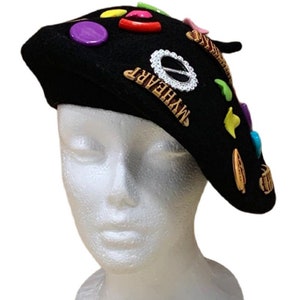 May include: Black beret with colourful buttons, rhinestones, and a gold "MYHEART" charm.