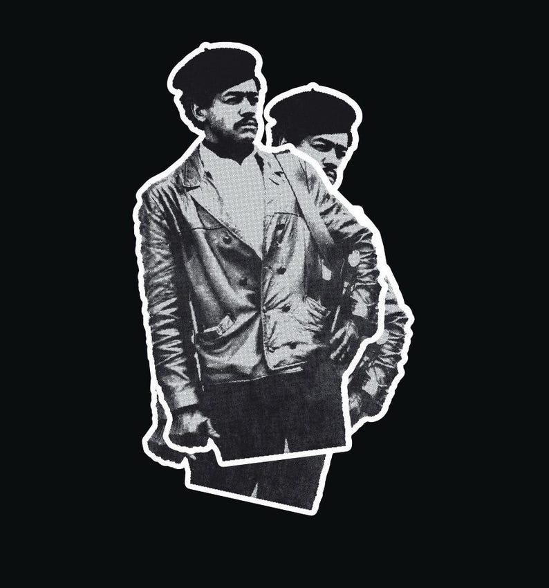 May include: Black and white photograph of a person wearing a leather jacket and a beret. The person is standing with their arms crossed and looking to the side.