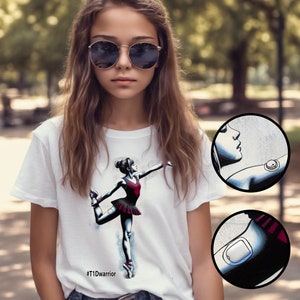 May include: A white t-shirt with a graphic of a ballerina in a red tutu. The shirt has the text '#T1Dwarrior' printed on the bottom. The image also shows two close-up images of a medical device on a person's arm.