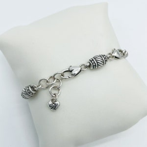 Silver Plated Barrel Slide Charm Bracelet with Heart Closures