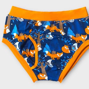 May include: Blue and orange underwear with a repeating pattern of foxes, owls, and trees.