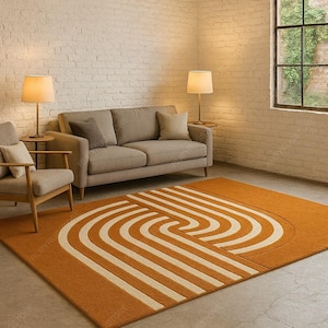 May include: An orange area rug with a cream-colored geometric design in a living room setting. The rug is rectangular and features a repeating pattern of curved lines. The room includes a sofa, armchair, and lamps.