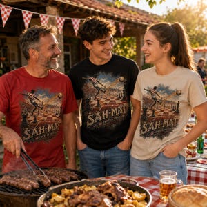 May include: Three t-shirts in red, black, and beige featuring a graphic print of a soccer player kicking a ball on a chessboard with the text &Scaron;AH-MAT CROATIA SOCCER. The shirts have short sleeves and a crew neckline, displaying a detailed illustration.