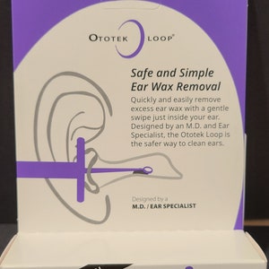 May include: A white and purple Ototek Loop box. The box features the text "The Original Ear Loop" and "Safe and Simple Ear Wax Removal." The box also has a diagram of an ear and the ear wax removal tool. The text "Improved Design" is also visible.