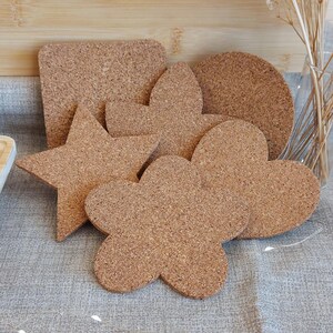 SOTTOCANDELA SUGHERO. Sottocandela di sughero, a scelta tra varie forme.