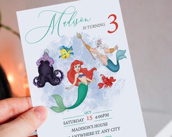 May include: A birthday invitation featuring characters from the Little Mermaid. The invitation is for a girl named Madison who is turning 3. The invitation is decorated with a blue and white watercolor background and features Ariel, Ursula, King Triton, and Flounder. The text on the invitation reads "Madison is turning 3" and includes the date, time, and location of the party.