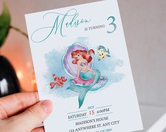 May include: A birthday invitation featuring Ariel, the Little Mermaid, sitting on a seashell. The invitation is for a 3-year-old girl named Madison. The text reads "Madison is turning 3" and includes details about the party, including the date, time, and location.