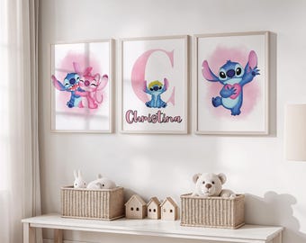 May include: Three framed prints featuring the character Stitch from Lilo & Stitch. The prints have a light wood frame and depict Stitch in various poses with pink accents. One print includes the name "Christina". Below, two wicker baskets hold stuffed animals and decorative wooden houses.
