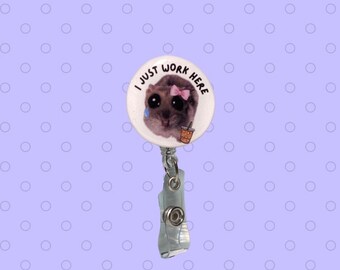 Sad Hamster Bade Reel “I just work here”, available as a pin