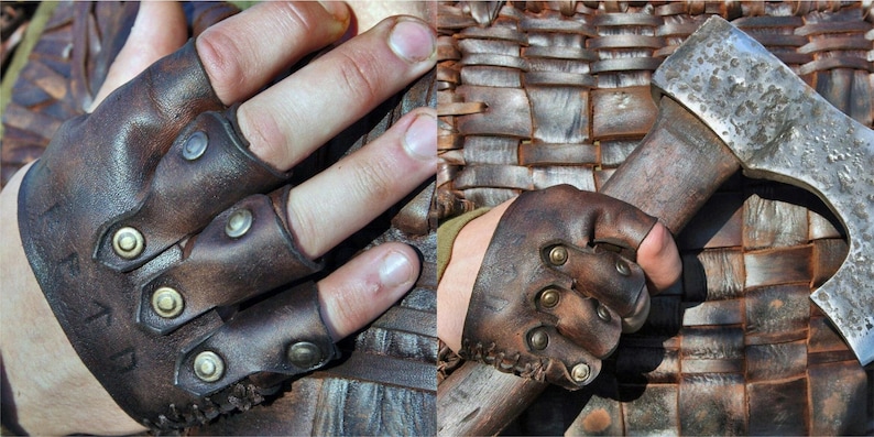May include: A dark brown leather fingerless glove featuring three individual finger straps secured with metallic brass-toned rivets. The leather has a weathered, textured finish with visible stitching along the wrist edge and embossed lettering.
