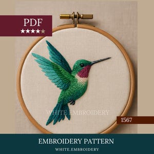 May include: Embroidery pattern featuring a detailed hummingbird design in shades of green, teal, and red, displayed in a wooden embroidery hoop. The text "WHITE EMBROIDERY" and "EMBROIDERY PATTERN" are visible.