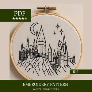 May include: Embroidery pattern featuring a black line drawing of a castle with a crescent moon and stars. The design is set in a wooden embroidery hoop. The text "EMBROIDERY PATTERN" and "WHITE.EMBROIDERY" are also visible.
