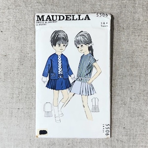 May include: A Maudella 5506 sewing pattern envelope for a dress and jacket for ages 3 and 4. The white paper cover features a black and white illustration of two children wearing the garments, including a blue jacket and a striped dress.