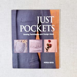 May include: A white ceramic mug with a black handle and the text "But First, Coffee" in a handwritten style. The mug is likely 11-15 ounces, perfect for a morning beverage.