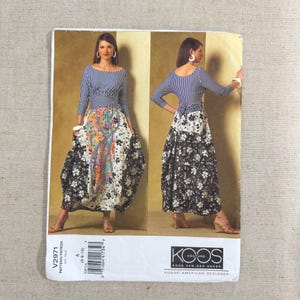 May include: Vogue American Designer pattern V2971. The pattern features a dress with a striped bodice and a floral print skirt. The dress is modeled in the image. The pattern includes the text "KOOS COUTURE KOOS VAN DEN AKKER".