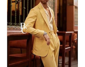 May include: A yellow suit with a matching blazer and trousers. The blazer has a notched lapel and a two-button closure. The suit is worn with a patterned shirt. The image has a warm, inviting feel.