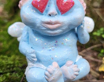 Estuche para encendedor de Cupido Loco / Regalo coleccionable extraño con querubín ángel bebé con purpurina azul para San Valentín