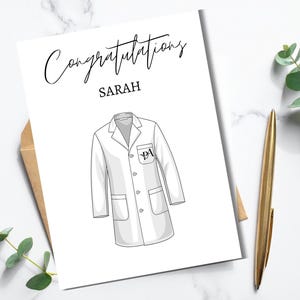 May include: A set of three ceramic mugs with a speckled, matte finish. The mugs are in shades of cream, light gray, and dark gray. Each mug has a simple, minimalist design, perfect for coffee or tea.