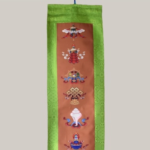 Tibetan wall hanging with message from the dalai lama and embroidered buddhist symbols