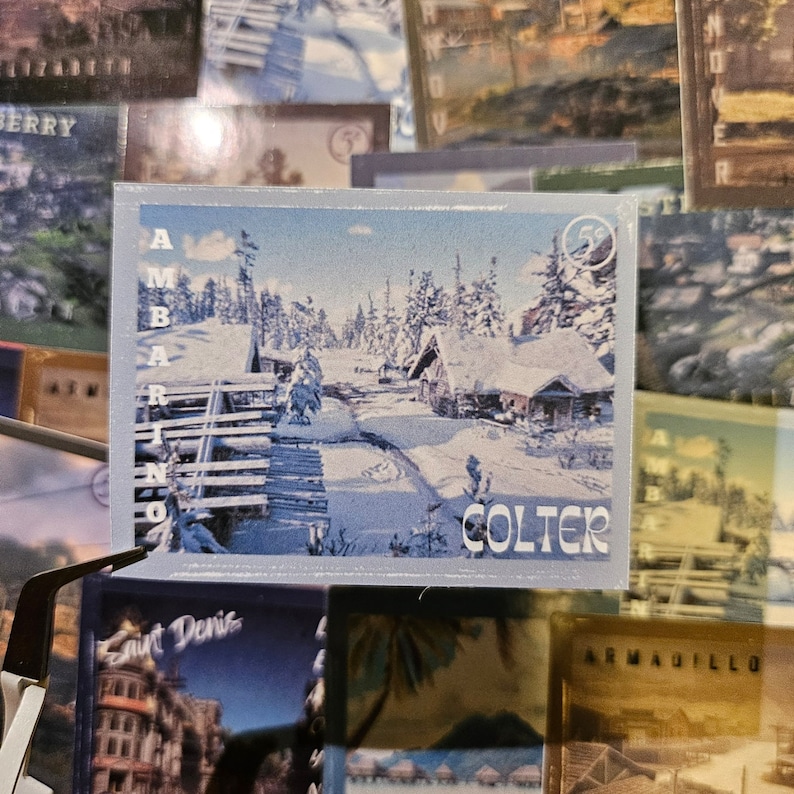May include: A vintage postcard featuring a snowy winter scene with a cabin in the woods. The postcard has the words "Colter" and "Ambarino" printed on it.