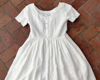 White linen retro dress with buttons on the back,  size 10.