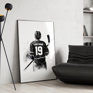 a black and white picture of a hockey player