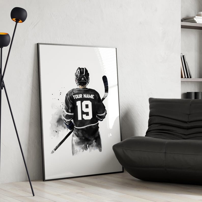 a black and white picture of a hockey player