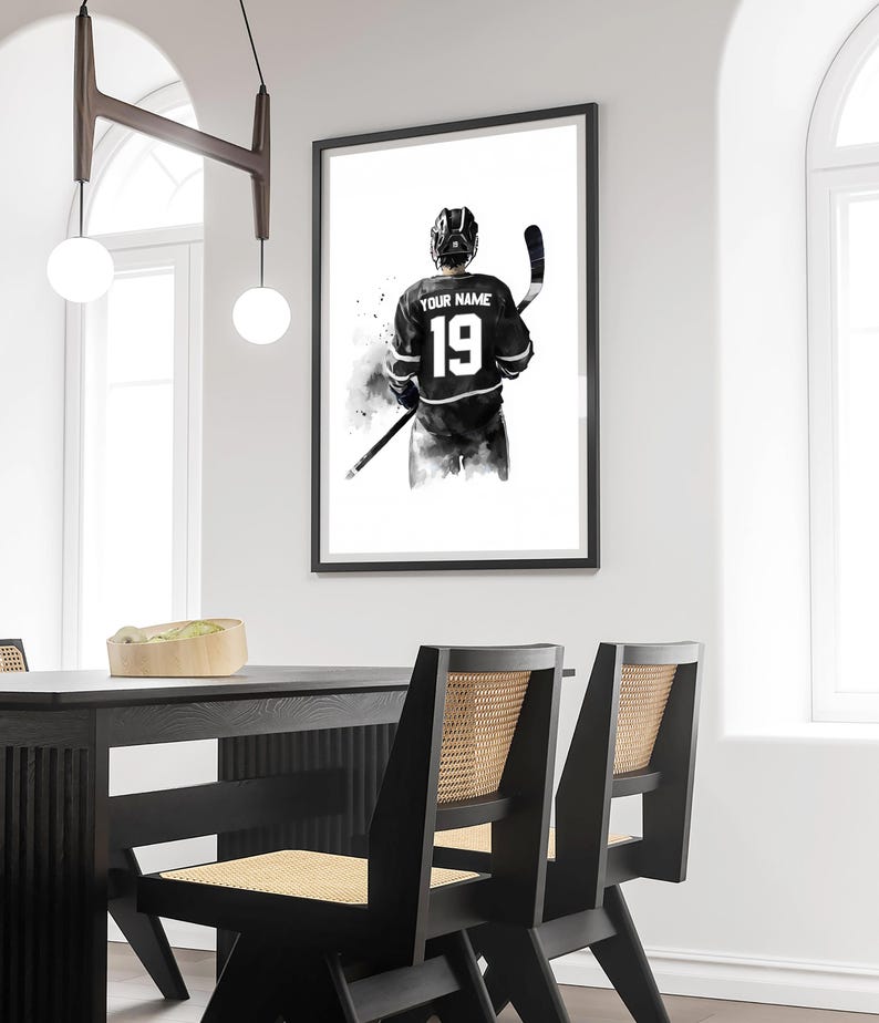 a black and white picture of a hockey player