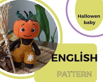 May include: Crochet pattern for a Halloween pumpkin baby doll. The doll is wearing overalls with a spider web design. The pattern is in English.