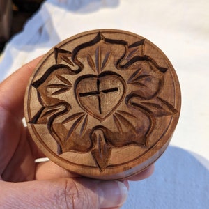 Hand carved pear wood cookie stamp with Luther Rose design