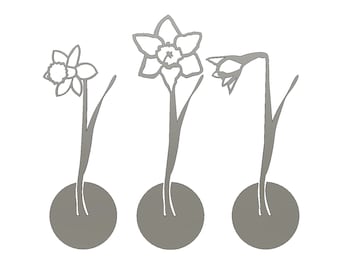 May include: Three grey illustrations of daffodils in different stages of growth. The first daffodil is in full bloom, the second is in bud, and the third is wilted.