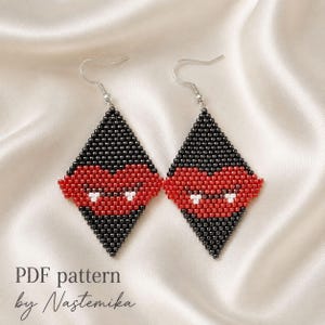 May include: A pair of diamond-shaped beaded earrings featuring a black and red color scheme with a central red heart design and small white accents. The earrings hang from silver-toned metal hooks. The text PDF pattern by Nastemika is visible.