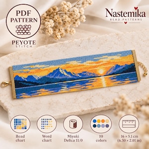 May include: A rectangular peyote stitch bead bracelet featuring a landscape of mountains and a sunset over water in shades of blue, orange, and yellow. The piece includes gold-toned metal end bars, a lobster clasp, and an extender chain.