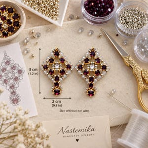May include: A pair of diamond-shaped beaded earrings featuring deep purple and clear crystals with metallic silver accents. The earrings measure 1.2 inches by 0.8 inches without ear wires. The design includes a central clear crystal surrounded by purple stones.