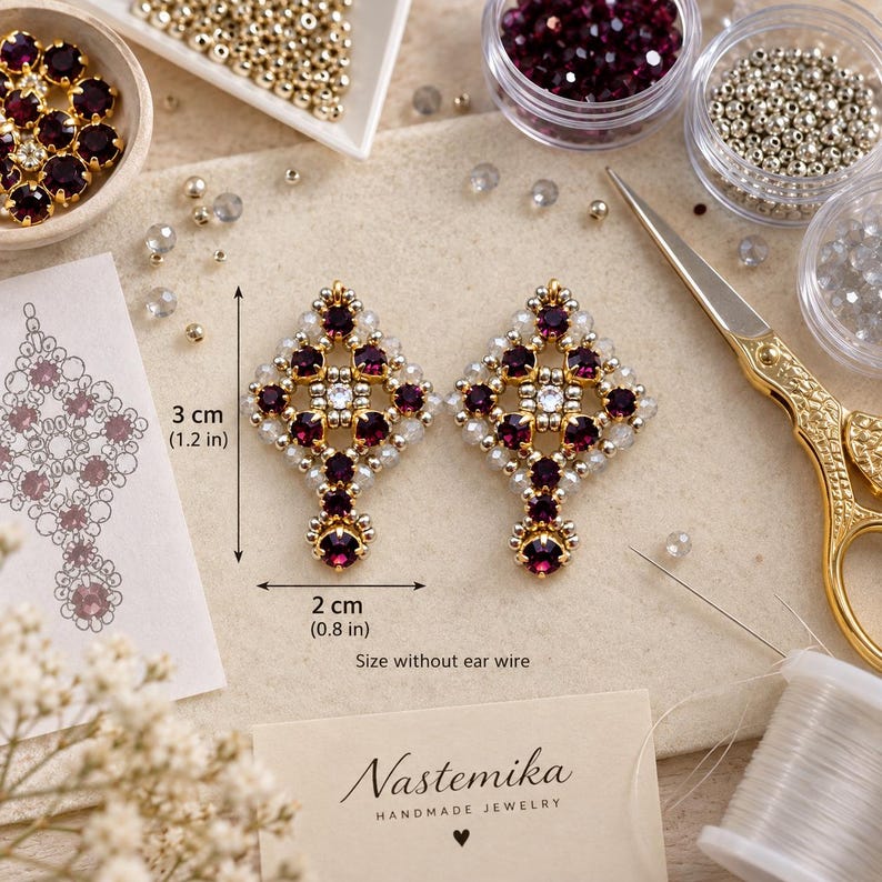 May include: A pair of diamond-shaped beaded earrings featuring deep purple and clear crystals with metallic silver accents. The earrings measure 1.2 inches by 0.8 inches without ear wires. The design includes a central clear crystal surrounded by purple stones.