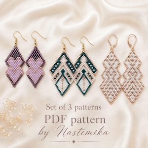 May include: Three pairs of beaded earrings featuring diamond-shaped geometric designs in purple and light pink, dark green and white, and solid white. The text reads: Set of 3 patterns, PDF pattern by Nastemika. Each pair hangs from gold-toned hooks.