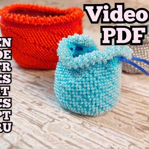 May include: Three beaded items: a red basket, a blue drawstring pouch, and a silver pouch. The blue pouch has a drawstring and is filled with a darker blue material. The image includes the text "Video+PDF" and a list of language codes.