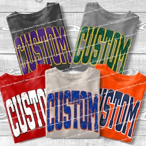 Puede incluir: Cinco camisetas de manga corta en negro, gris, rojo, beige y naranja. Cada camiseta presenta la palabra CUSTOM impresa en una fuente varsity grande, arqueada y desgastada en el pecho en colores contrastantes: morado, verde, blanco, azul y azul marino.