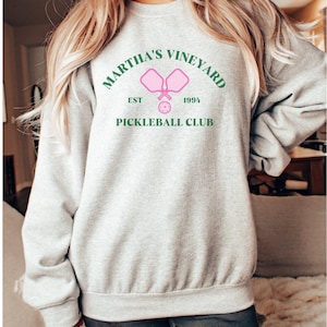 May include: Gray sweatshirt with a green and pink graphic that says "Martha's Vineyard Est. 1994 Pickleball Club".